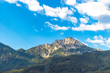 Alpine mountain and hill landscape panorama blue sky Salzburg Austria.