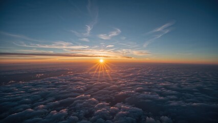 Dawn breaking over a clear azure sky with scattered clouds