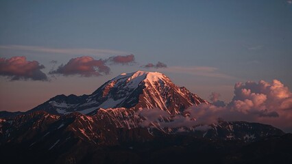 Fototapeta premium Sun Rises Beyond the Ridge Seen from a High Vantage