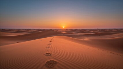 Sun setting behind expansive desert sands