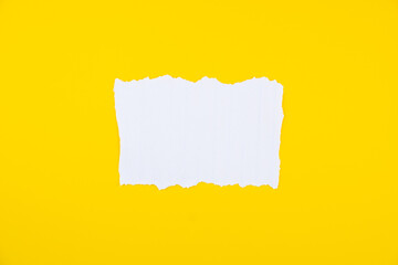 Torn white paper frame on vibrant yellow background for creative design use, highlighting message or content space in advertising and promotional materials