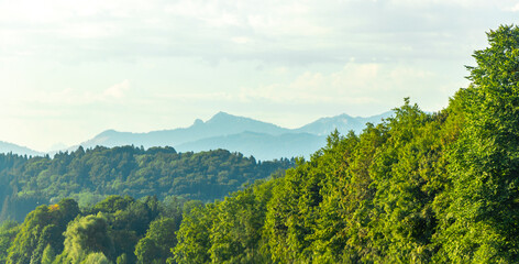 Fototapeta premium Alpine mountain and hill landscape panorama blue sky Salzburg Austria.