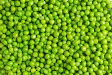 Boiled green peas background. Natural food concept. Vegetarian and vegan food. Horizontal orientation. Selective focus. Top view.