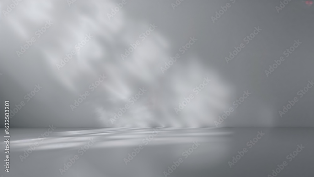 Poster gradient shading of silver and gray dominates the surface, highlighted by a backdrop of light gray a