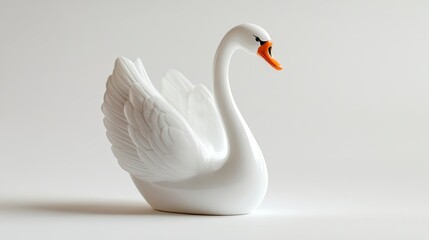 White swan figurine on white background. (2)