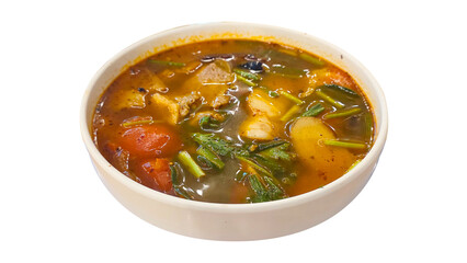 Hot and sour Thai tom saap soup made with pork bones, herbs, chili, and vegetables in a rich, flavorful broth