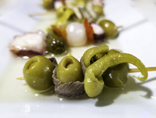 Chili, olive, and anchovy skewer