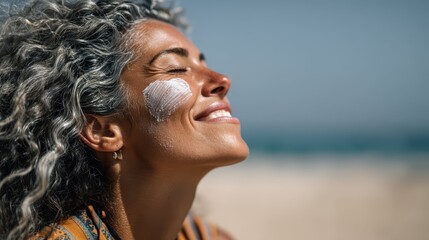 Woman Applying Sunscreen on Her Face While Enjoying a Beach Day
