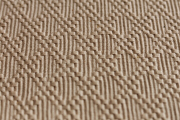 Close-up of beige fabric texture background. Macro shot.