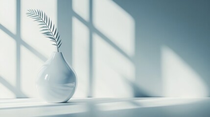 White ceramic vase with branch casting dramatic shadows against pastel blue wall for home decor styling