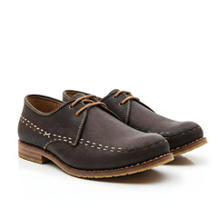 pair of brown shoes on white background