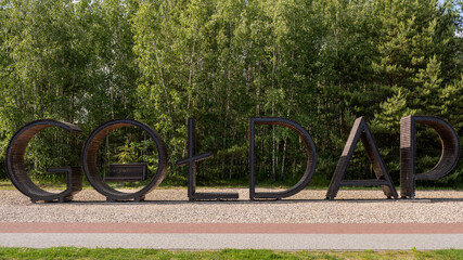 Large wooden sign spelling 