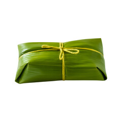 Traditional Tamale wrapped in a banana leaf tied with string.  Authentic Latin American cuisine.