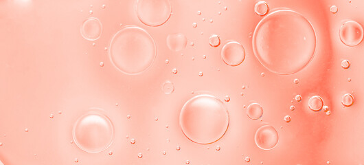 Orange Liquid Bubbles Macro Background. Abstract macro background with multiple orange liquid bubbles and soft gradient tones, close-up view.