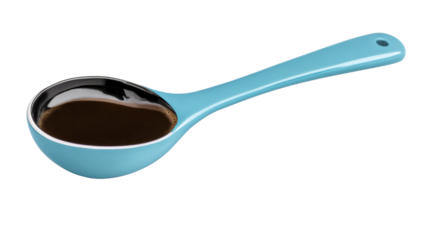 Blue spoon filled with coffee on a transparent background