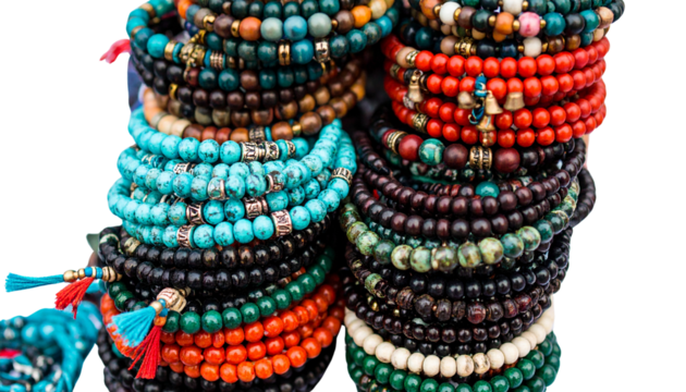 Stack of beaded bracelets in boho style with charms, isolated on transparent background