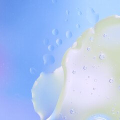 Soft Gradient Macro Bubbles. Macro abstract photo of liquid bubbles over soft blue-green gradient background.