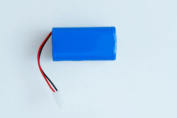 Blue battery for robot vacuum cleaner. White background.