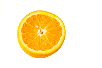 A ripe orange cut in half on a white background