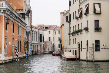 Canal flowing between colorful buildings in venice, italy