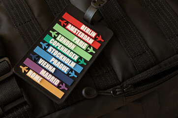 Information sign attached to airplane hand luggage, sign with the names of European capitals,