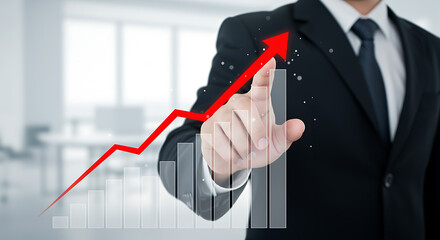 Businessman touching upward trending red arrow and financial chart suit hand