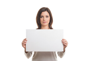 Naklejka premium Woman holding a blank white sign, neutral expression, studio shot.
