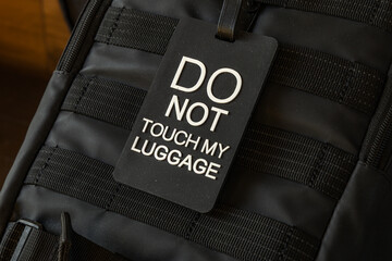 Information sign attached to airplane hand luggage, sign with the names of European capitals,