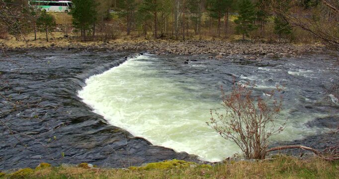 river Elo flowing over a small weir, river control at Eldfjord