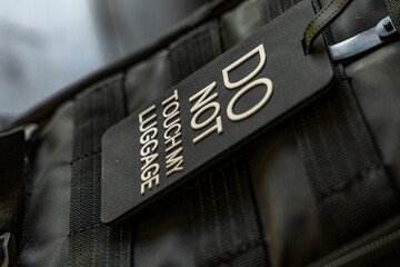 Information sign attached to airplane hand luggage, sign with the names of European capitals,