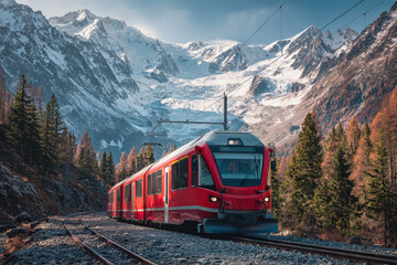 Red electric train traversing scenic mountain paths with glaciers and lush forests