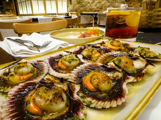 Gourmet Scallops Dish in Elegant Restaurant Setting