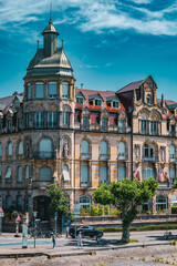 Naklejka premium Panoramic view of beautifully preserved Art Nouveau and historic buildings along the Rhine River in Konstanz Germany. The colorful facades and ornate architecture create a charming cityscape on a brig