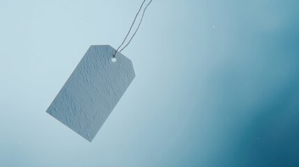 Vintage paper tag floating in blue space with abstract texture, minimalist design concept.