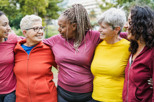 Happy multi generational women having fun together - Multiracial friends chatting after sport workout outdoor - Friendship and healthy lifestyle concept - Main focus on african female face
