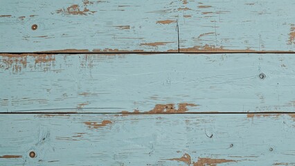 Aged wooden panel featuring distressed light blue paint