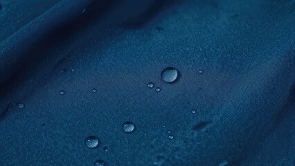 Detailed view of water droplets on durable waterproof textile