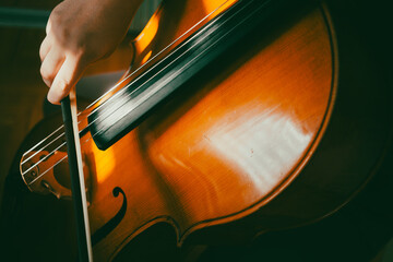 A cellist practices playing