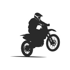 Silhouette of a motorcyclist performing a wheelie on a dirt bike