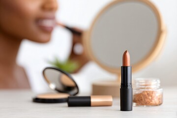African american woman applying makeup, focusing on lips. Beauty routine and self-care concept. Skincare background.