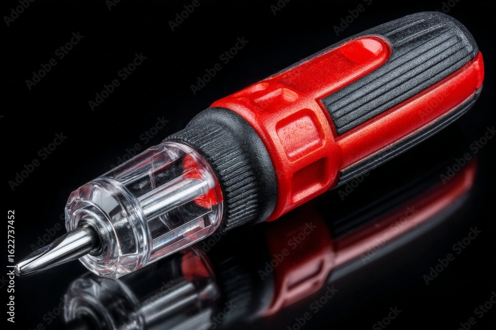 Poster precision screwdriver with a clear handle resting on a reflective surface in a studio setting