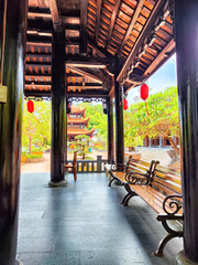 Visit to a serene Buddhist temple with vibrant surroundings in Vietnam during the day