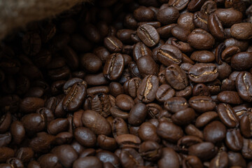 Close-up image of a coffee bean bag filled with coffee beans.