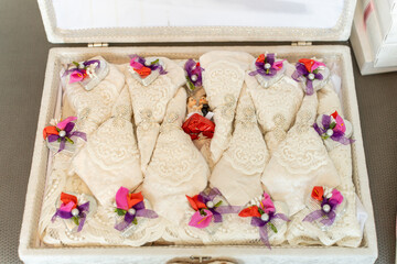 Traditional handmade bridal accessories elegantly arranged in a decorative box for a wedding...
