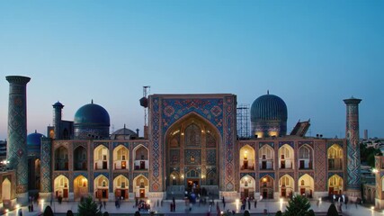 majestic samarkand mosque with intricate blue and red tilework, prominent domes, and ornate minarets at dusk. islamic architecture. cultural heritage, travel, tourism. uzbekistan independence day