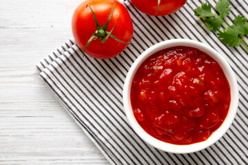 Organic Tomato and Cilantro Salsa in a Bowl, top view. Copy space.