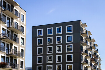 Contemporary building facade with some balconies. Close up of a modern apartment building.