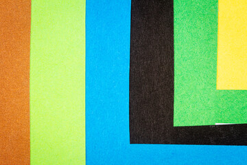 Multi color background from a paper of different colors. Abstract colorful vibrant textures paper.