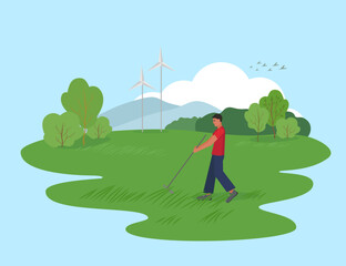 A man raking grass in a field against the backdrop of windmills