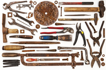 Flat lay of new and used hand tools on white background. Large collection of various tools and bits...